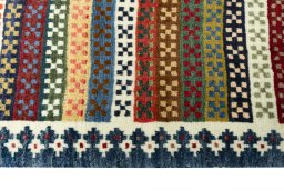 Close-up detail of 2000s Persian Gabbeh rug from Iran / Persia showing Wool weave