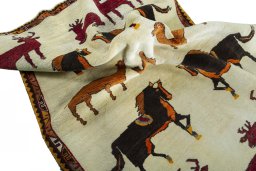 Corner detail of 2000s Persian Gabbeh rug showing border pattern and Wool pile