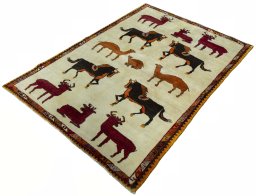 Corner detail of 2000s Persian Gabbeh rug showing border pattern and Wool pile