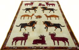 Surface texture of 2000s Persian Gabbeh rug with natural Wool and intricate pattern