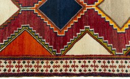 Close-up detail of 2000s Persian Gabbeh rug from Iran / Persia showing Wool weave