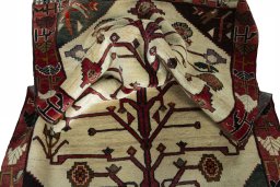 Corner detail of 2000s Persian Gabbeh rug showing border pattern and Wool pile