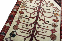 Backside of handmade 2000s Persian Gabbeh rug showing knot structure and weave density
