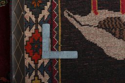 Surface texture of 2000s Persian Gabbeh rug with natural Wool and intricate pattern