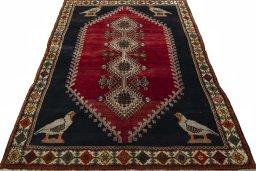 Surface texture of 2000s Persian Gabbeh rug with natural Wool and intricate pattern