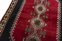 Backside of handmade 2000s Persian Gabbeh rug showing knot structure and weave density