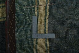 Close-up detail of 2000s Persian Gabbeh rug from Iran / Persia showing Wool weave