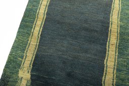 Backside of handmade 2000s Persian Gabbeh rug showing knot structure and weave density