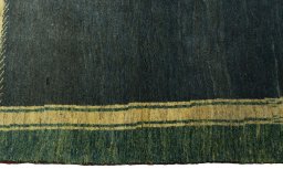 Close-up detail of 2000s Persian Gabbeh rug from Iran / Persia showing Wool weave