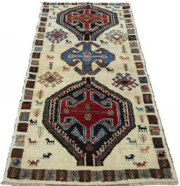 Surface texture of 2000s Persian Gabbeh rug with natural Wool and intricate pattern
