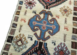 Backside of handmade 2000s Persian Gabbeh rug showing knot structure and weave density