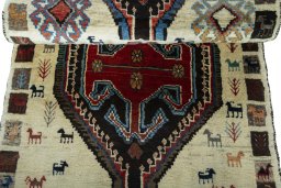 Full view of 2000s Persian Gabbeh rug from Iran / Persia, 188 × 82 cm in Beige tones