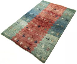 Corner detail of 1970s Persian Gabbeh rug showing border pattern and Wool pile