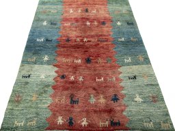 Surface texture of 1970s Persian Gabbeh rug with natural Wool and intricate pattern
