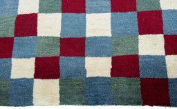 Central medallion detail of 2000s Persian Gabbeh rug from Pakistan