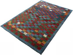 Corner detail of 2000s Persian Gabbeh rug showing border pattern and Wool pile
