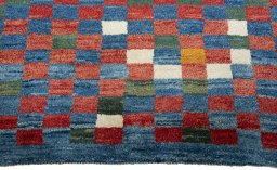 Central medallion detail of 2000s Persian Gabbeh rug from Pakistan