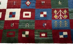 Central medallion detail of 2000s Persian Gabbeh rug from Pakistan