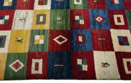 Close-up detail of 2000s Persian Gabbeh rug from Pakistan showing Wool weave