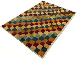 Corner detail of 2000s Persian Gabbeh rug showing border pattern and Wool pile