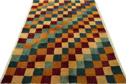 Surface texture of 2000s Persian Gabbeh rug with natural Wool and intricate pattern
