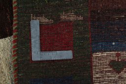 Close-up detail of 2000s Persian Gabbeh rug from Pakistan showing Wool weave