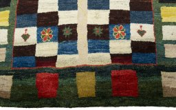 Central medallion detail of 2000s Persian Gabbeh rug from Pakistan