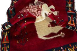 Corner detail of 2000s Persian Gabbeh rug showing border pattern and Wool pile