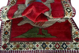 Corner detail of 2000s Persian Gabbeh rug showing border pattern and Wool pile