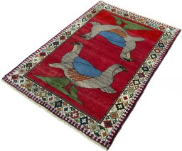 Corner detail of 2000s Persian Gabbeh rug showing border pattern and Wool pile