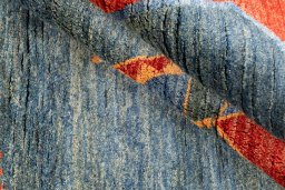 Corner detail of 1975s Persian Gabbeh rug showing border pattern and Wool pile