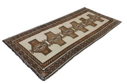 Corner detail of 2000s Persian Gabbeh rug showing border pattern and Wool pile