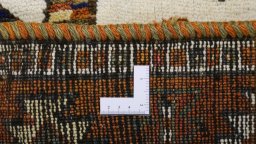 Corner detail of 1920s Persian Gabbeh rug showing border pattern and Wool pile