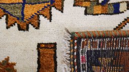 Full view of 1920s Persian Gabbeh rug from Iran / Persia, 367 × 144 cm in Beige tones