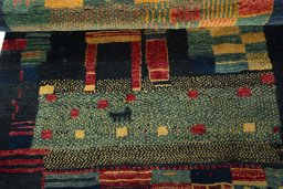Full view of 2000s Persian Gabbeh rug from Pakistan, 185 × 115 cm in Multi Color tones