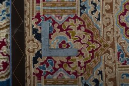 Backside of handmade 2000s Kerman rug showing knot structure and weave density