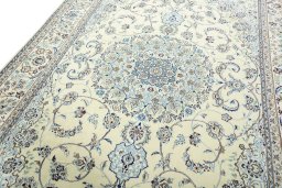 Backside of handmade 2000s Nain rug showing knot structure and weave density