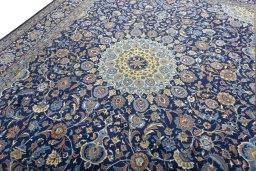Backside of handmade 2000s Kashmar rug showing knot structure and weave density