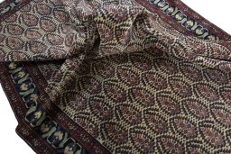 Corner detail of 1930s Hamedan rug showing border pattern and Wool pile