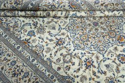 Close-up detail of 2000s Kashan rug from Iran / Persia showing Wool weave