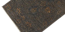 Backside of handmade New Farahan rug showing knot structure and weave density