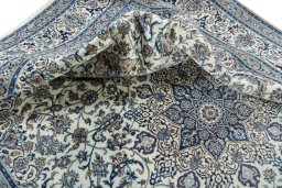 Surface texture of New Nain rug with natural Wool and intricate pattern