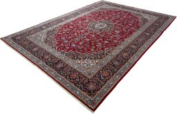 Corner detail of 2000s Kashan rug showing border pattern and Wool pile