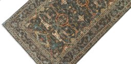 Backside of handmade New Farahan rug showing knot structure and weave density