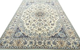 Surface texture of 2000s Nain rug with natural Wool and intricate pattern