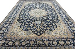 Surface texture of 2000s Najafabad rug with natural Wool and intricate pattern