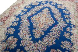 Backside of handmade 1970s Kerman rug showing knot structure and weave density