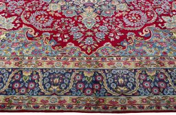 Corner detail of 1970s Kerman rug showing border pattern and Wool pile
