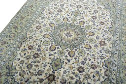 Backside of handmade 2000s Kashan rug showing knot structure and weave density
