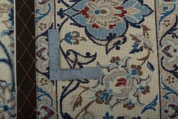 Backside of handmade 2000s Nain rug showing knot structure and weave density